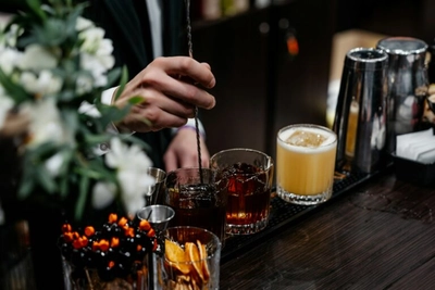 Mixing alcohol with ice.